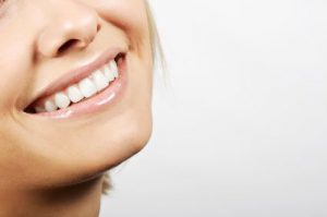 close-up of a woman smiling with white teeth