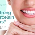 Graphic shows a woman smiling with her teeth and her hands under her chin with Heading text: "How Strong Are Porcelain Veneers?" Footer text: "Read our latest blog on our website to learn more."
